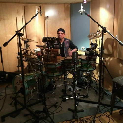 A person with a technical complex drum set